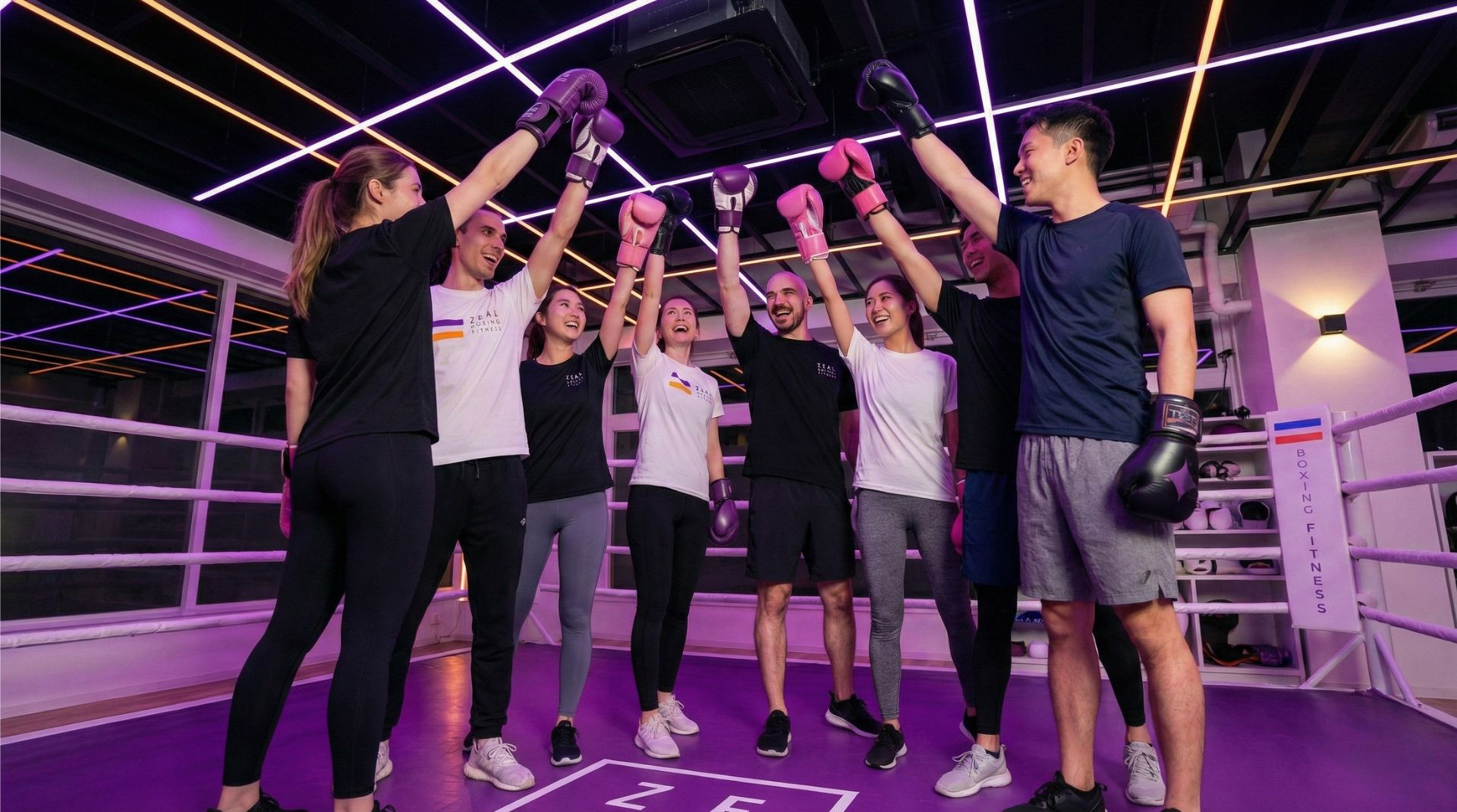 Diverse group of people high-fiving after a boxing workout